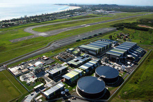 An aerial view of the Gold Coast Desalination Plant with the beach and ocean in the background.