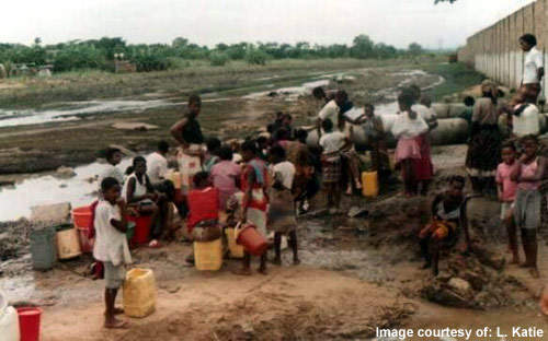 Children at a Mozambique watering point. The country's Millennium Development goal aims to halve the percentage of people without sustainable access to potable water by 2015.