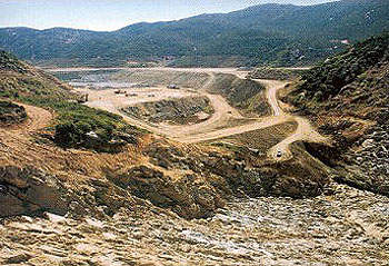 The dam site during excavation that involved approximately 700,000yd³ of granite being blasted and cleared.