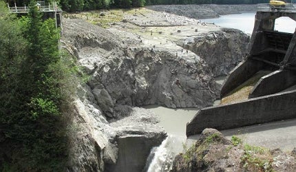 The final stage, which began in July, comprises controlled blasts to clear what is left of the dam wall